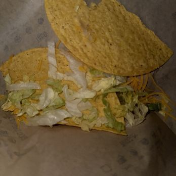 Taco Bell - How do you forget to put meat in a freaking taco? This is how I got the taco and I took one bite to realize there's no taco meat. - Fast Food Near Me - Salisbury, Maryland