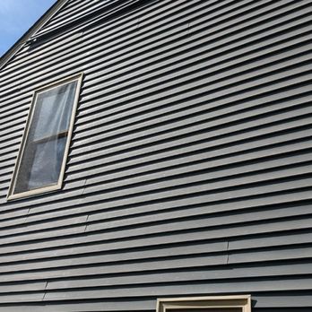 Carolina Custom Home Improvements - Damaged warped siding that needed to be replaced - Roofing Near Me