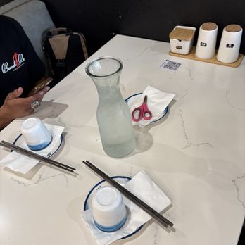 Highland Noodles - Table setting. Scissors for the never-ending noodles - Noodles Near Me - Milpitas, California Highland Noodles - Table setting. Scissors for the never-ending noodles - Noodles Near Me - Milpitas, California