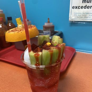 Mr. Penguin Snacks Plus - Octopus with cherry raspa at the bottom - Juice Bars & Smoothies Near Me - Houston, Texas