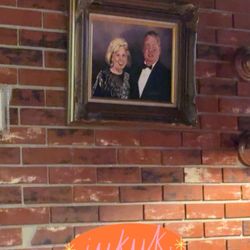 Mackie's Pizza of Harrisburg - Late owners (Mackie & Roxy) hanging above the reserved table for family.