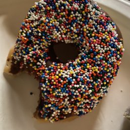 a chocolate donut with sprinkles
