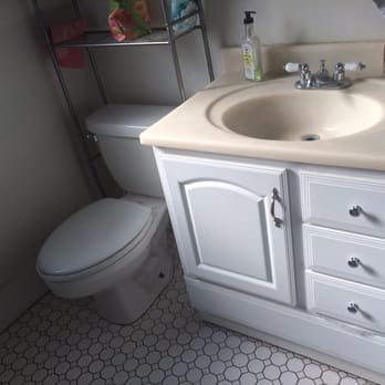 Seabreeze Renovators - Before - old vanity and toilet - General Contractors Near Me