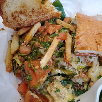 Frita Batidos - This may not look appetizing, but it was delicious! Chorizo burger with a bunch of additional toppings - Burgers Near Me - Detroit, Michigan