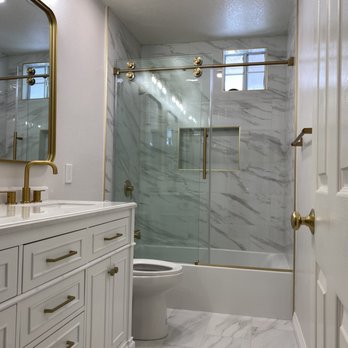 Pure Renovations Socal - a bathroom with a shower, toilet, and sink - General Contractors Near Me Pure Renovations Socal - a bathroom with a shower, toilet, and sink - General Contractors Near Me