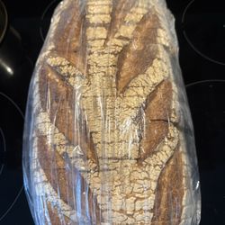 Mediterra Bakehouse - Farm deli loaf packaged for wholesale pickup (They package individual orders in paper to maintain appropriate hydration)