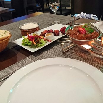 Kesar - Chicken wings, lamb curry, naan, and Mango Lassi, not shown. Total bill, $50. - Indian Near Me - Bern, BE Kesar - Chicken wings, lamb curry, naan, and Mango Lassi, not shown. Total bill, $50. - Indian Near Me - Bern, BE