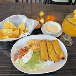 Lunch flautas, chips, salsa, and a side of queso, with a mango margarita to wash it all down.