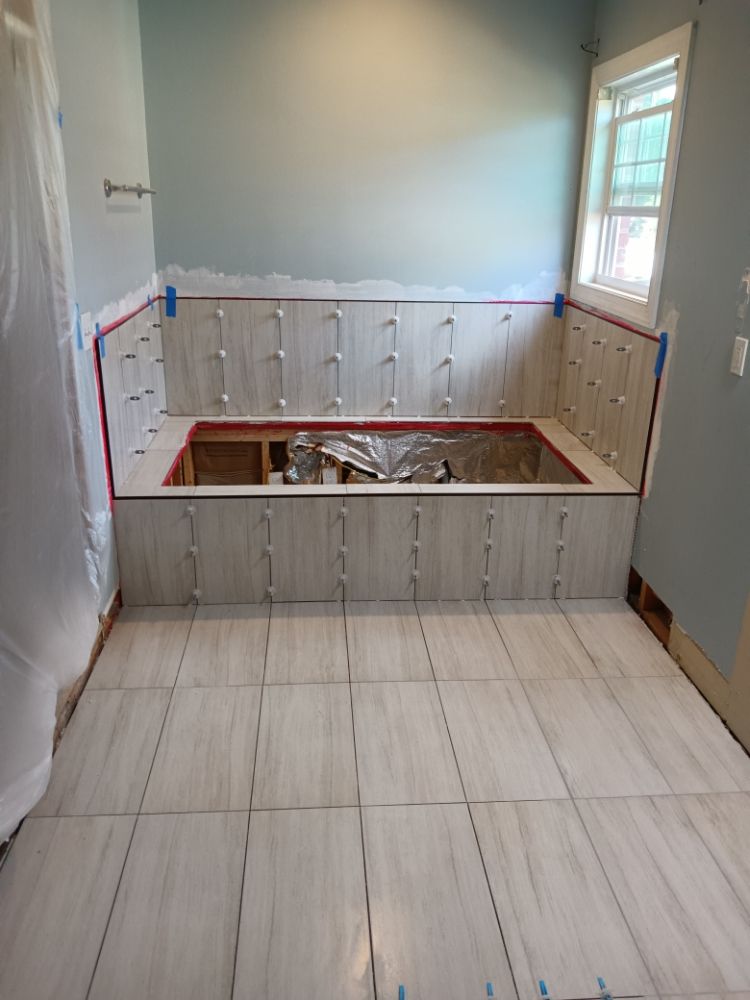 Slide of Bathmatic Custom Tile and Shower
