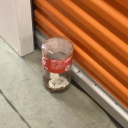 It's been here for three weeks already. A piss bottle in front of storage 2496. It's been here for three weeks already. A piss bottle in front of storage 2496.
