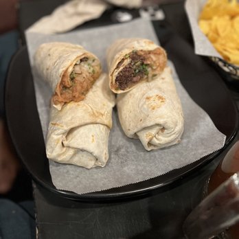 Taqueria Jalisco - Mexican burrito with barbacoa and LOTS of onions. - Mexican Near Me - San Angelo, Texas