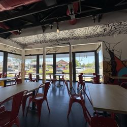 Dave's Hot Chicken - Seating with large open windows -- love the painted walls and ceilings