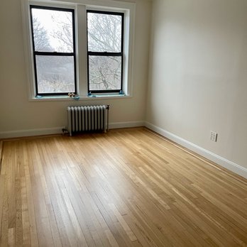 Wood Vitalize - an empty room with a radiator - Flooring Near Me - New York, New York Wood Vitalize - an empty room with a radiator - Flooring Near Me - New York, New York