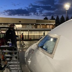 Ground crew cleaning a bird off our window
