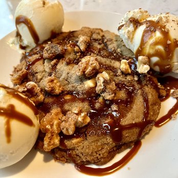 Village Social - Half-baked cookie dessert, easily enough for two. - New American Near Me - Asheville, North Carolina Village Social - Half-baked cookie dessert, easily enough for two. - New American Near Me - Asheville, North Carolina