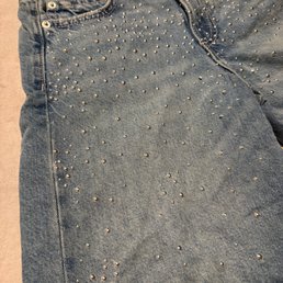 Photos of item stained from the dye of the shorts. Photos of item stained from the dye of the shorts.