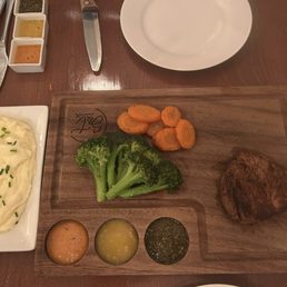 8 ounce fillet comes with vegetables, mashed potatoes on the side. We also had a small side salad.