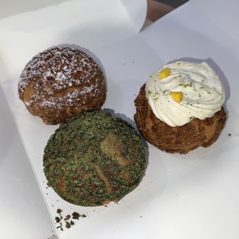 Bibble & Sip - Earl Grey Vanilla Cream Puff (left), Matcha White Chocolate Cream Puff (middle), Mango Cloud Cream Puff (right) - Coffee & Tea Near Me - New York, New York Bibble & Sip - Earl Grey Vanilla Cream Puff (left), Matcha White Chocolate Cream Puff (middle), Mango Cloud Cream Puff (right) - Coffee & Tea Near Me - New York, New York