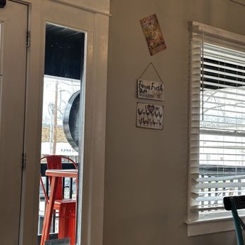 Only Chicken - a table and chairs in a room - Chicken Shop Near Me - Nashville, Tennessee