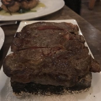 ADEGA Restaurant - Ribeye sizzling on salt rock - Portuguese Near Me - San Jose, California ADEGA Restaurant - Ribeye sizzling on salt rock - Portuguese Near Me - San Jose, California