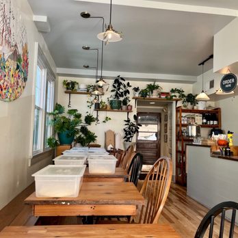 1000 Figs - a dining room with a table and chairs - Falafel Near Me - New Orleans, Louisiana 1000 Figs - a dining room with a table and chairs - Falafel Near Me - New Orleans, Louisiana