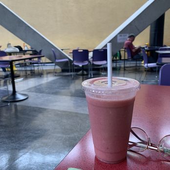 Natural Sensations - a smoothie in a plastic cup on a red table - Health Markets Near Me - San Francisco, California Natural Sensations - a smoothie in a plastic cup on a red table - Health Markets Near Me - San Francisco, California