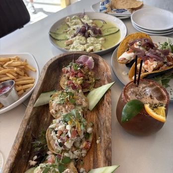 Crudo - Tostada sample, salmón and shrimp tacos, ceviche, and fries. - Latin American Near Me - Palm Springs, California Crudo - Tostada sample, salmón and shrimp tacos, ceviche, and fries. - Latin American Near Me - Palm Springs, California