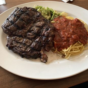 Mabella Italian Steakhouse - Traditional 16oz ribeye served with 2 sides. I choose shaved Brussels sprouts dates, bacon and Spaghetti with tomato & garlic sauce! - Italian Near Me - Columbus, Georgia Mabella Italian Steakhouse - Traditional 16oz ribeye served with 2 sides. I choose shaved Brussels sprouts dates, bacon and Spaghetti with tomato & garlic sauce! - Italian Near Me - Columbus, Georgia