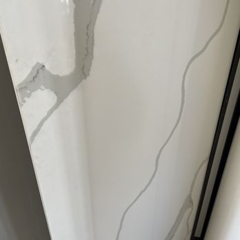 Sky Builders ZHR - The slab Callacata we choose for the kitchen, would be on the island with waterfall and all around and the countertops. - General Contractors Near Me