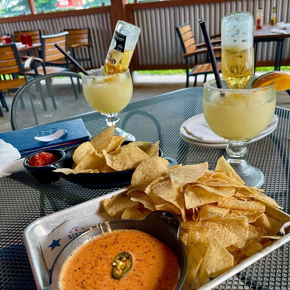 Lone Star Texas Grill - a plate of chips and a bowl of salsa - Tex-Mex Near Me - Milton, Ontario Lone Star Texas Grill - a plate of chips and a bowl of salsa - Tex-Mex Near Me - Milton, Ontario