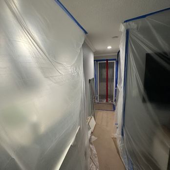 Exodus Property Restoration - a long hallway with plastic covering - General Contractors Near Me - San Diego, California