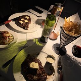 Ribeyes, fries, potato cakes Ribeyes, fries, potato cakes