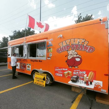 Fat Les's Chip Stand & Wham Burger! - a man standing in front of a food truck - Food Trucks Near Me - Ottawa, Ontario Fat Les's Chip Stand & Wham Burger! - a man standing in front of a food truck - Food Trucks Near Me - Ottawa, Ontario