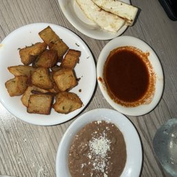 Side of panela, papas, frijoles, consomé Side of panela, papas, frijoles, consomé