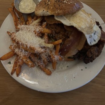 Hank's - Spicy chicken sandwich, with sweet potato fries. - Coffee & Tea Near Me - Austin, Texas Hank's - Spicy chicken sandwich, with sweet potato fries. - Coffee & Tea Near Me - Austin, Texas
