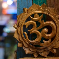 Wander - Hand carved Om plaque