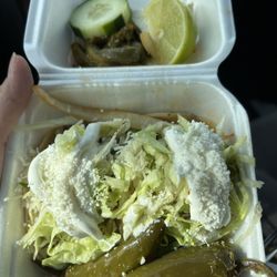 Tacos El Pelón IV - 2 steak tacos with sour cream and cheese.