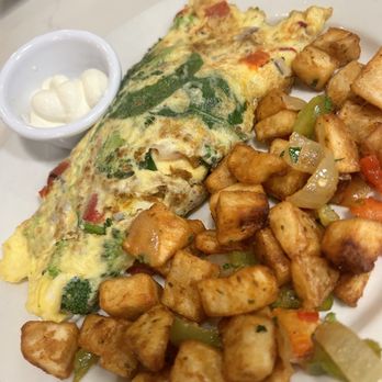 JAM Eateries - Goat cheese and spinach omelette with broccoli added. Fresh and delicious. The diced potatoes were well seasoned. - Breakfast & Brunch Near Me - Ellicott City, Maryland