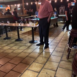 a man standing in a bar