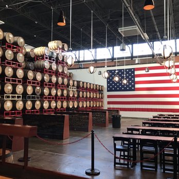 Revolution Brewing - Kedzie Brewery - How American...a large flag and beer barrels - Breweries Near Me - Chicago, Illinois Revolution Brewing - Kedzie Brewery - How American...a large flag and beer barrels - Breweries Near Me - Chicago, Illinois