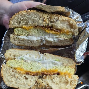 Libertalia - Bacon, egg, and cheese bagel with cream cheese cross-section. - Coffee & Tea Near Me - Owensboro, Kentucky
