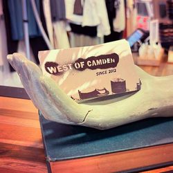 West of Camden - West of Camden 'Since 2012' business card within a mannequin hand