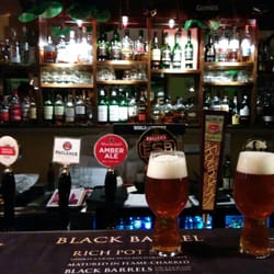 O'Malley's - Whiskeys in the back, on tap selection, IPAs settling