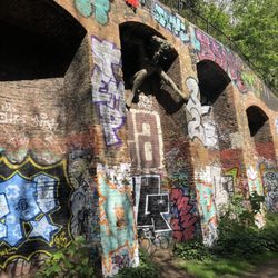 Parkland Walk - The Spriggan sculpture under the archways with graffiti