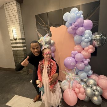 Hotel Nickel Plate Fishers, Tapestry Collection by Hilton - Manager Jamal with daughter at balloon arch for Swifty event - Hotels Near Me - Fishers, Indiana Hotel Nickel Plate Fishers, Tapestry Collection by Hilton - Manager Jamal with daughter at balloon arch for Swifty event - Hotels Near Me - Fishers, Indiana