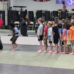 Colorado Krav Maga - A drill with each kiddo!