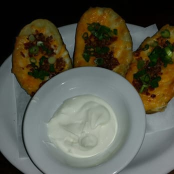 The Social Study - Classic potato skins: Idaho russets, cheddar cheese, rosemary/brown sugar rubbed bacon, sour cream, scallions ($9) - Wine Bars Near Me - San Francisco, California The Social Study - Classic potato skins: Idaho russets, cheddar cheese, rosemary/brown sugar rubbed bacon, sour cream, scallions ($9) - Wine Bars Near Me - San Francisco, California