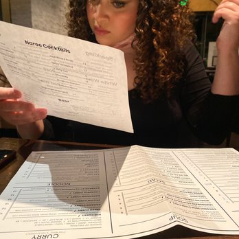 Naree Thai Restaurant - Daughter looking over menu - Thai Near Me - Long Beach, California Naree Thai Restaurant - Daughter looking over menu - Thai Near Me - Long Beach, California