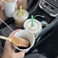 Brewed Awakenings - Waffle sticks in a cup with syrup and two iced oatmeal cookie lattes