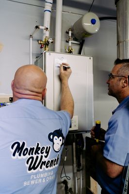 Tankless Water Heater Repair - Tankless Water Heater Service Completed by Wes, Master Plumber and Co-Owner of Monkey Wrench Plumbing in Midvale, Utah. We Can Fix Any Make & Model Tankless Water Heater. Call Today to Learn More. Tankless Water Heater Repair - Tankless Water Heater Service Completed by Wes, Master Plumber and Co-Owner of Monkey Wrench Plumbing in Midvale, Utah. We Can Fix Any Make & Model Tankless Water Heater. Call Today to Learn More.
